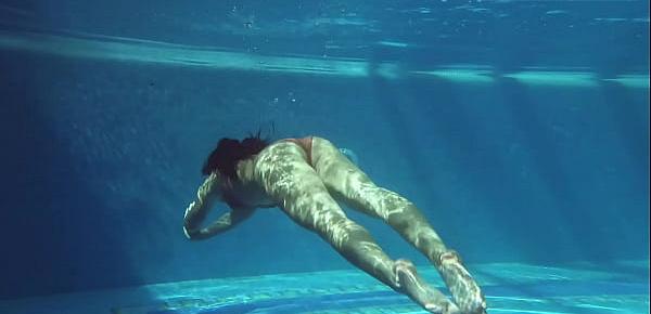 Kittina swims naked in the swimming pool